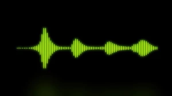 Green audio waveform on a black background