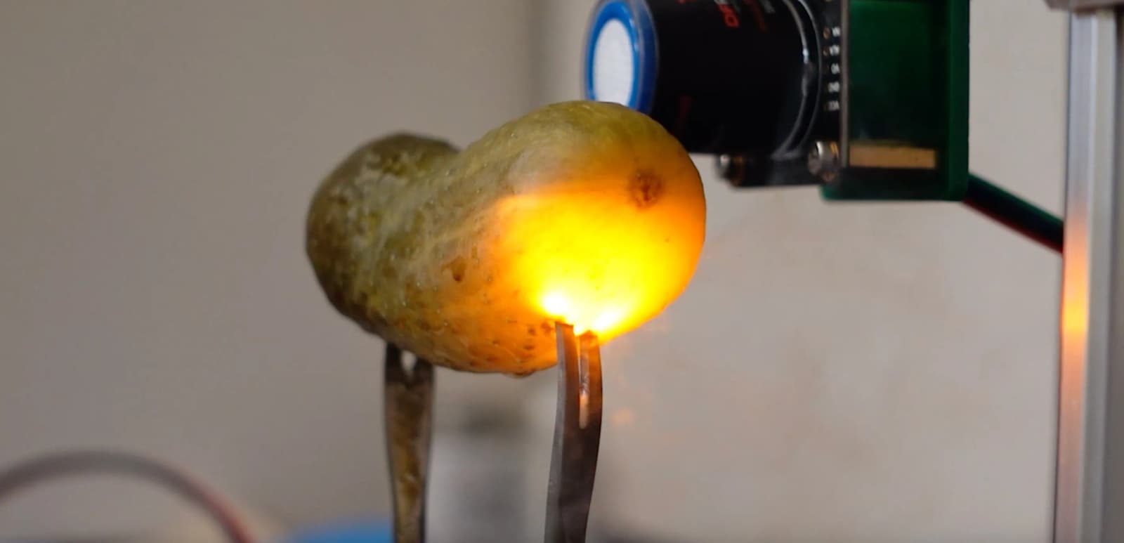 Why plugged-in pickle glows: Engineer burns 100-plus pickles to find answer