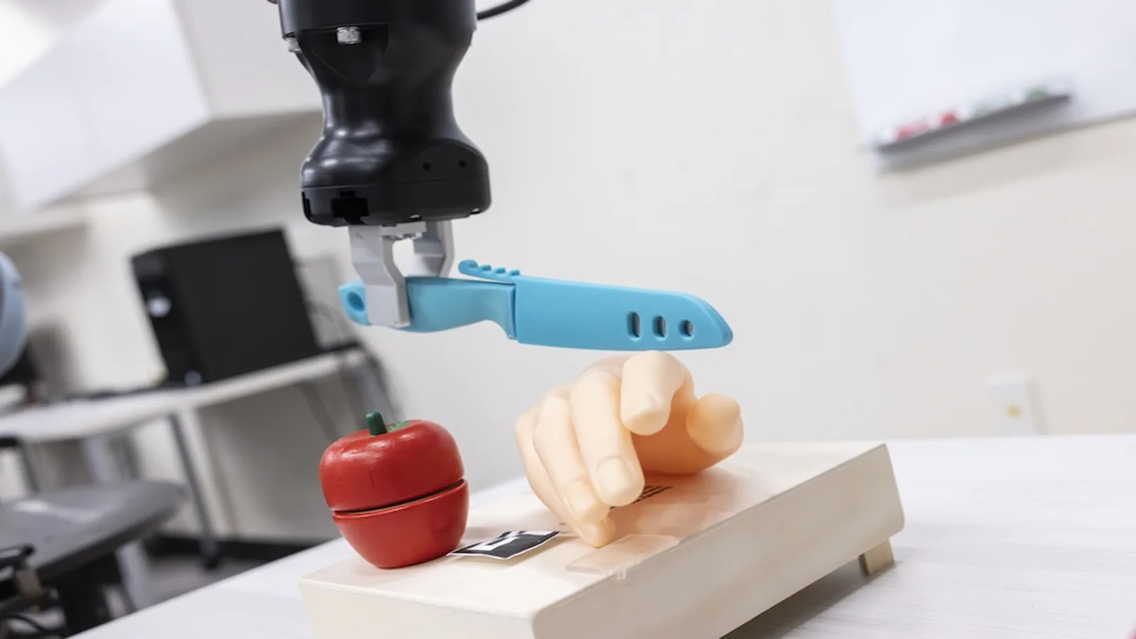 Two-letter trigger makes US robot turn knife toward human hand in security test