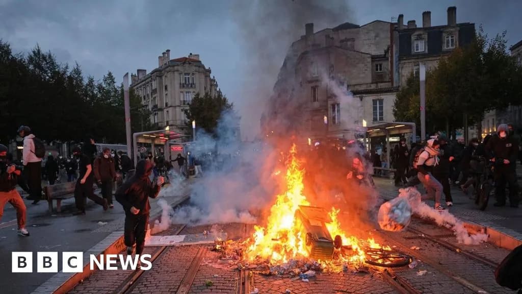 Protesters clash with police as a barricade burns during a demonstration against the high cost of living in Bordeaux, France. Photo: BBC News
