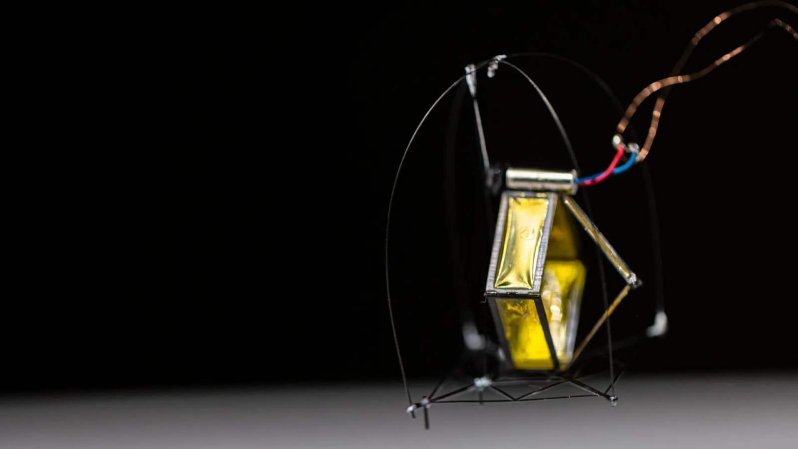 Frog-inspired robot hops over obstacles, lands, and prepares to jump again using tiny motor